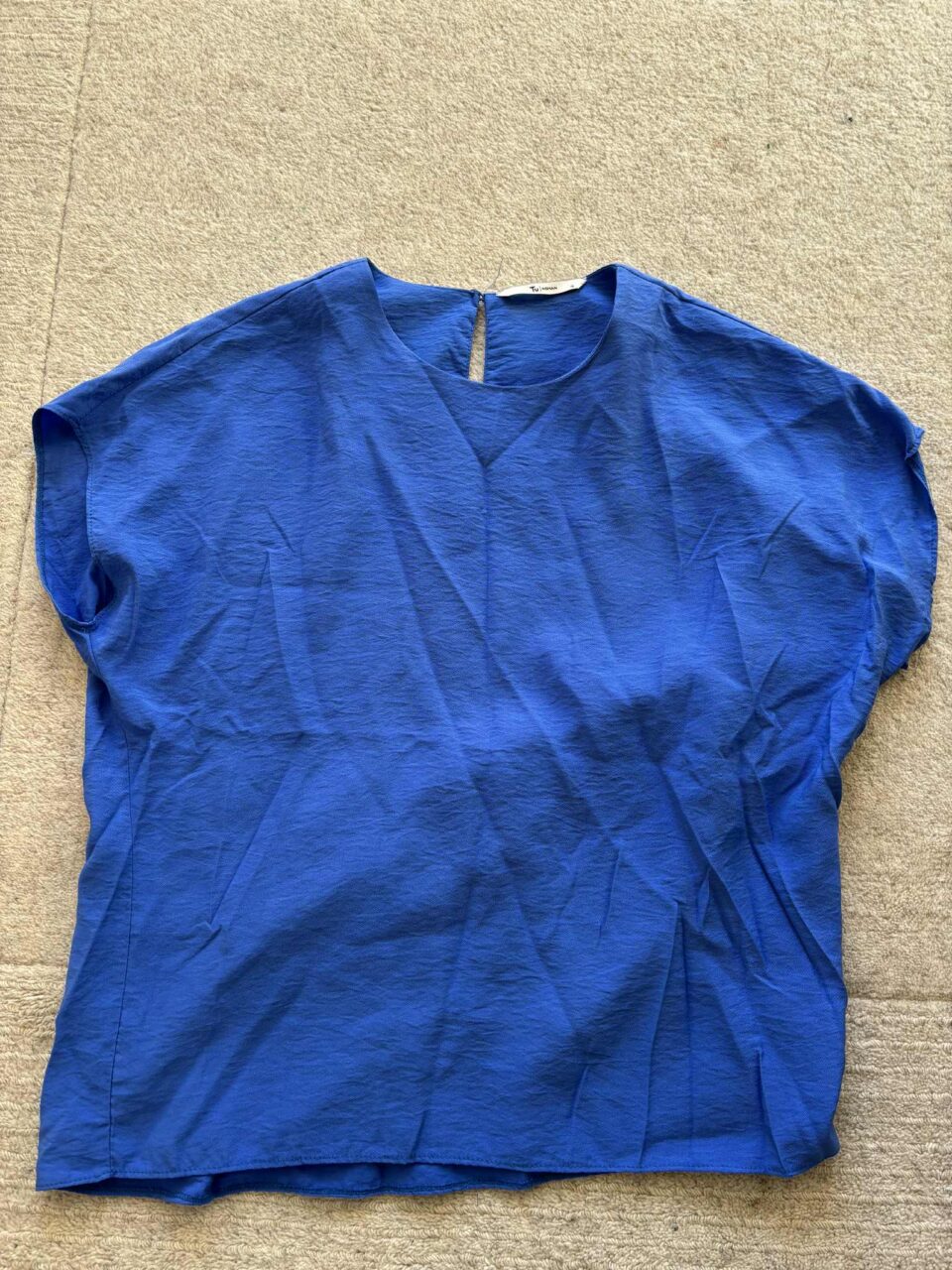 the blue top from the charity shop- front