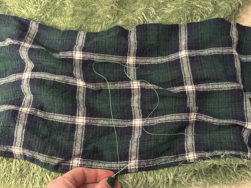 showing sewing the pouch into the jumper