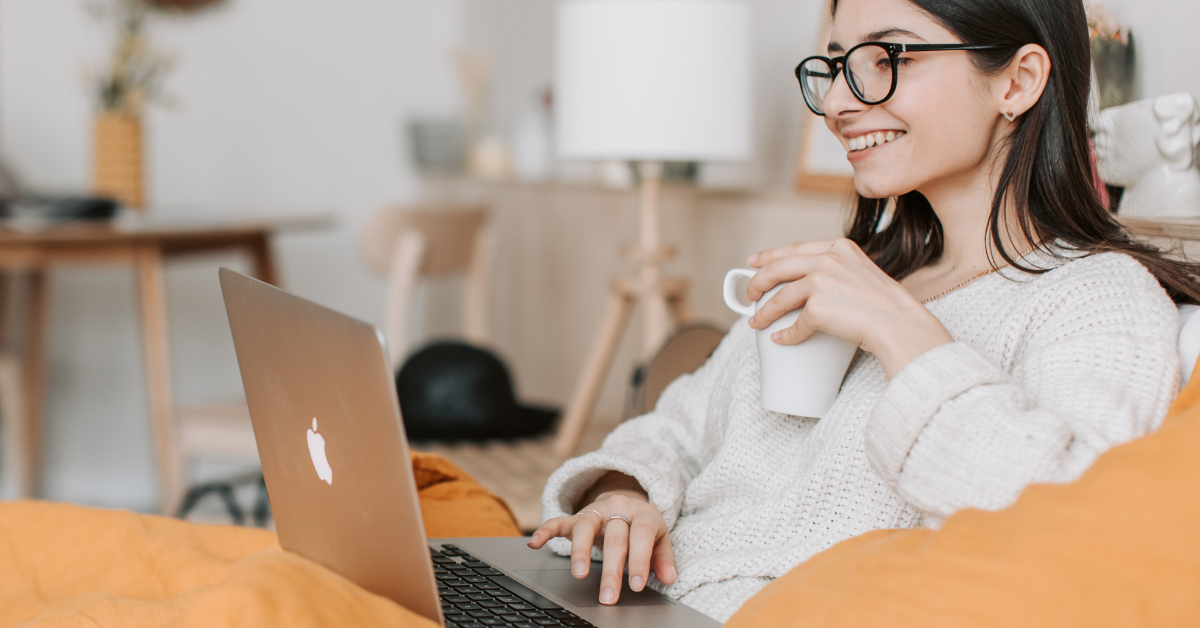 a lady online holding a mug and smiling