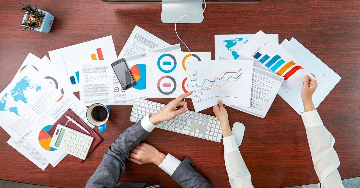 business looking at figures and graphs