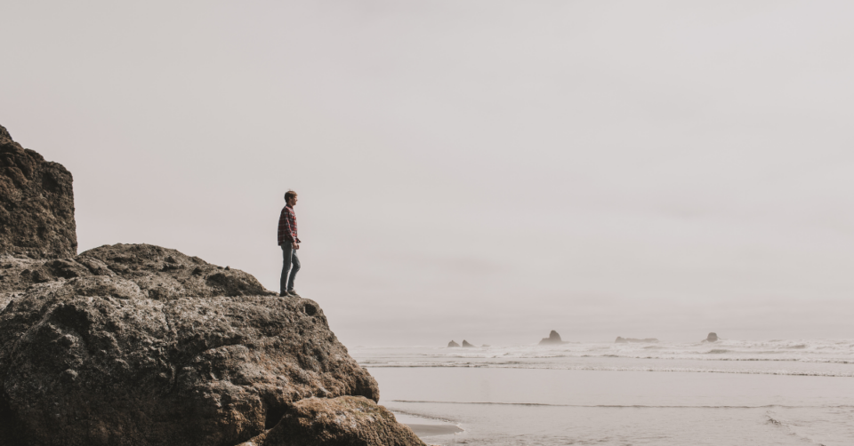 someone looking out across the sea