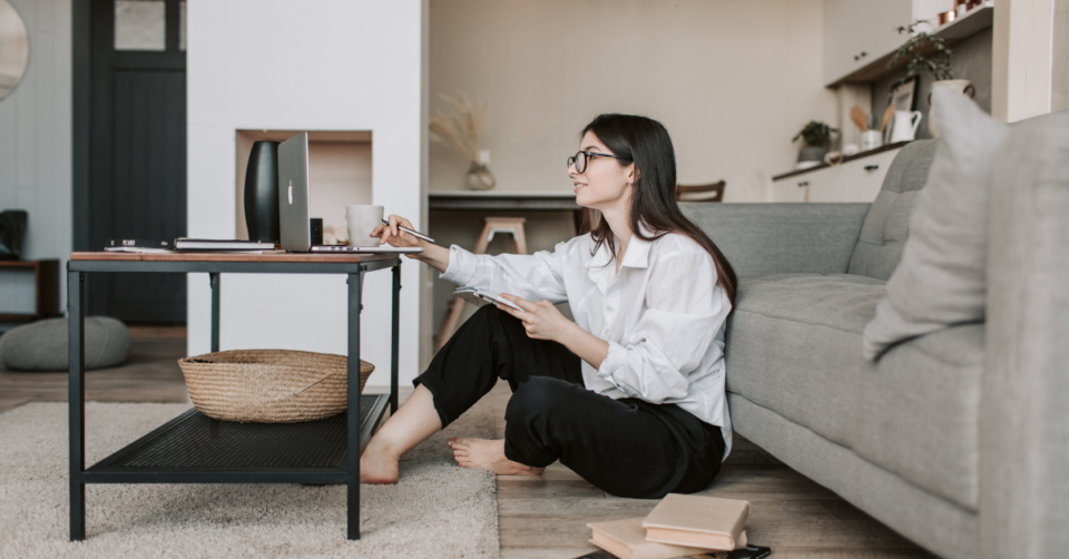 a woman in her home on a laptop