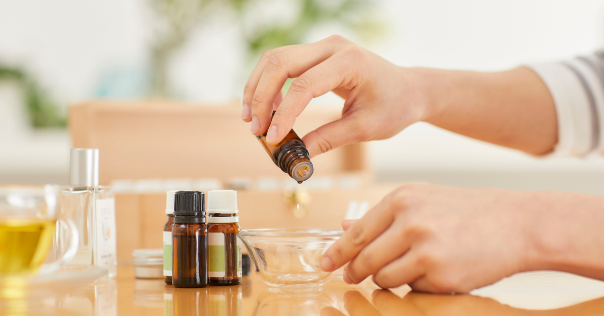 someone mixing up essential oils