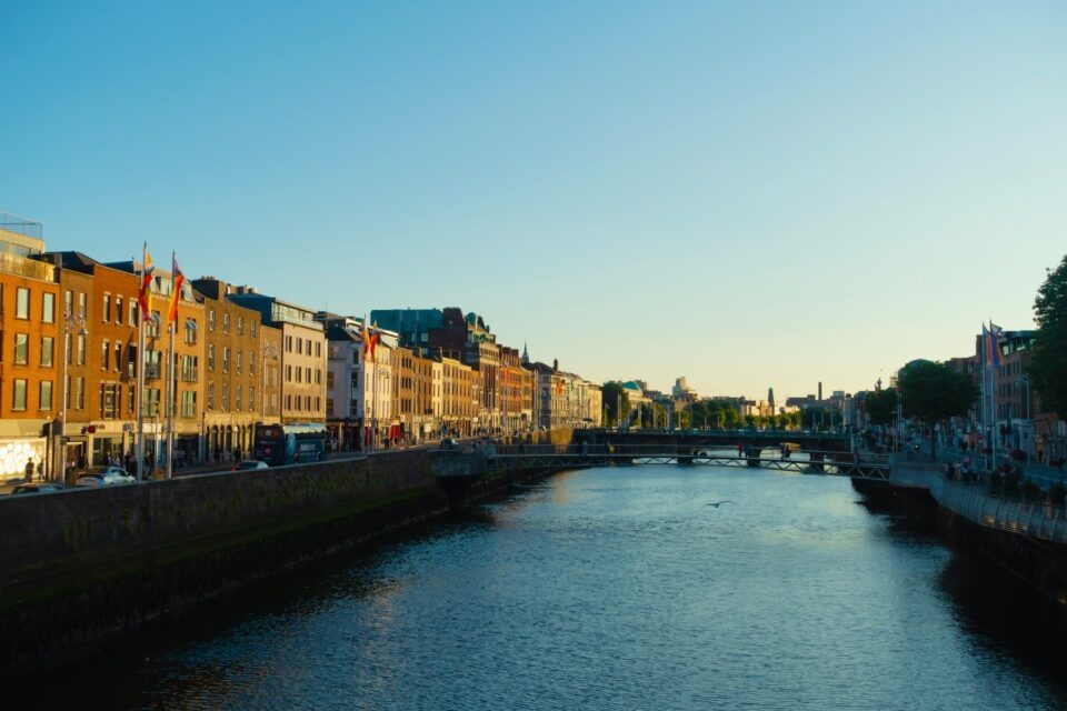 river with buildings and a clear sky