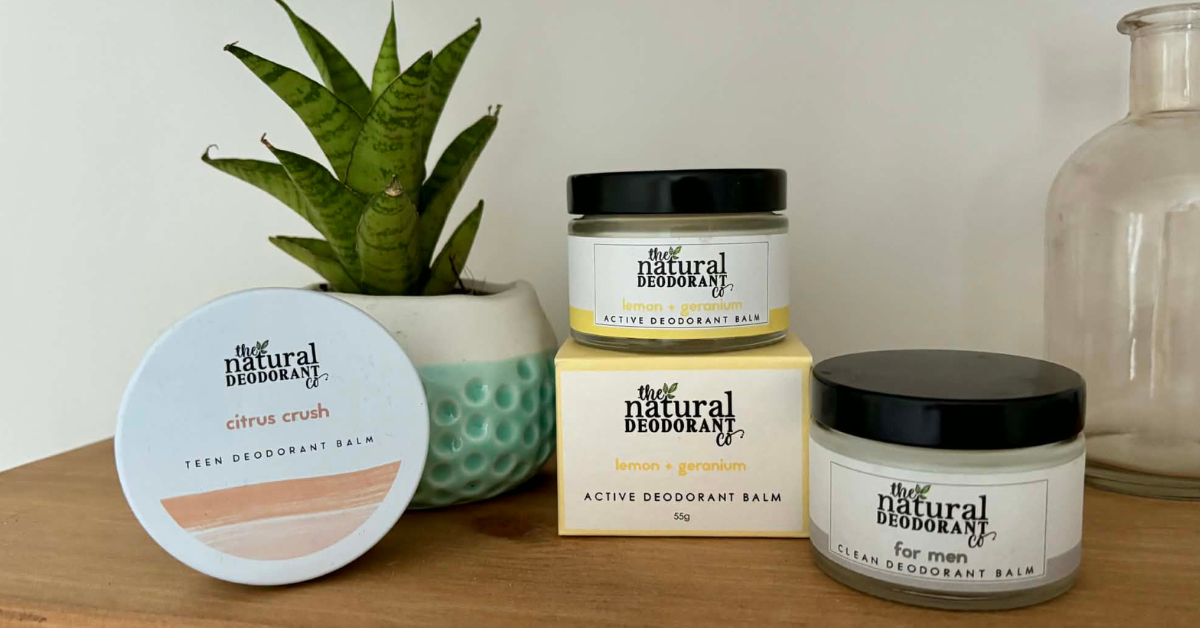 The Natural Deodorant co products on an oak shelf with an aloe plant