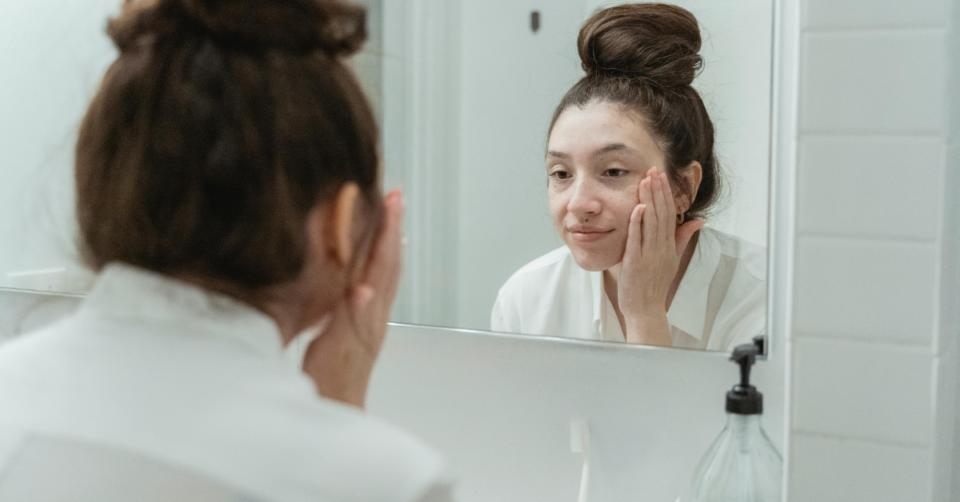 a woman doing her beauty routine