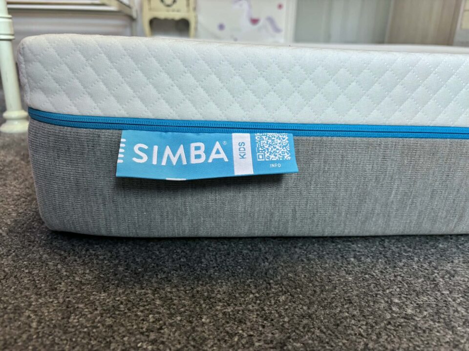 Simba kids mattress from the side with the label showing