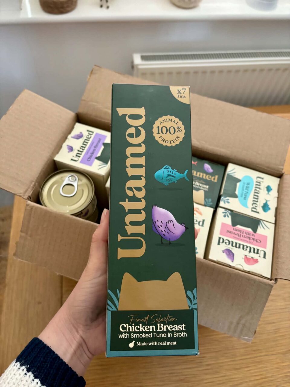 the untamed cardboard box in my hand