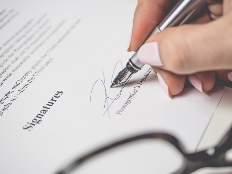 someone signing a contract