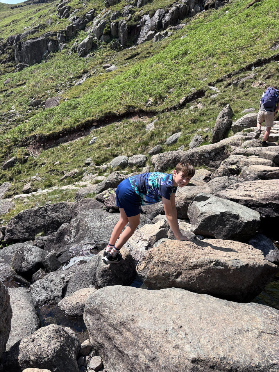 my eldest son climbing the large rocks up to Stickle Tarn