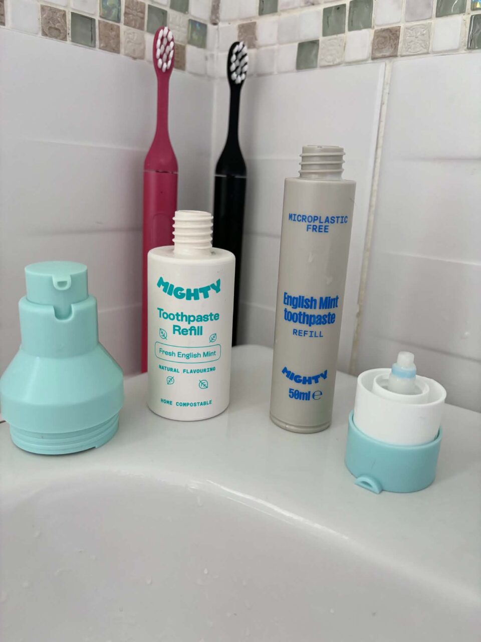 the refill tubes from Mighty Mouthcare. on the left the new version and on the right the taller original version