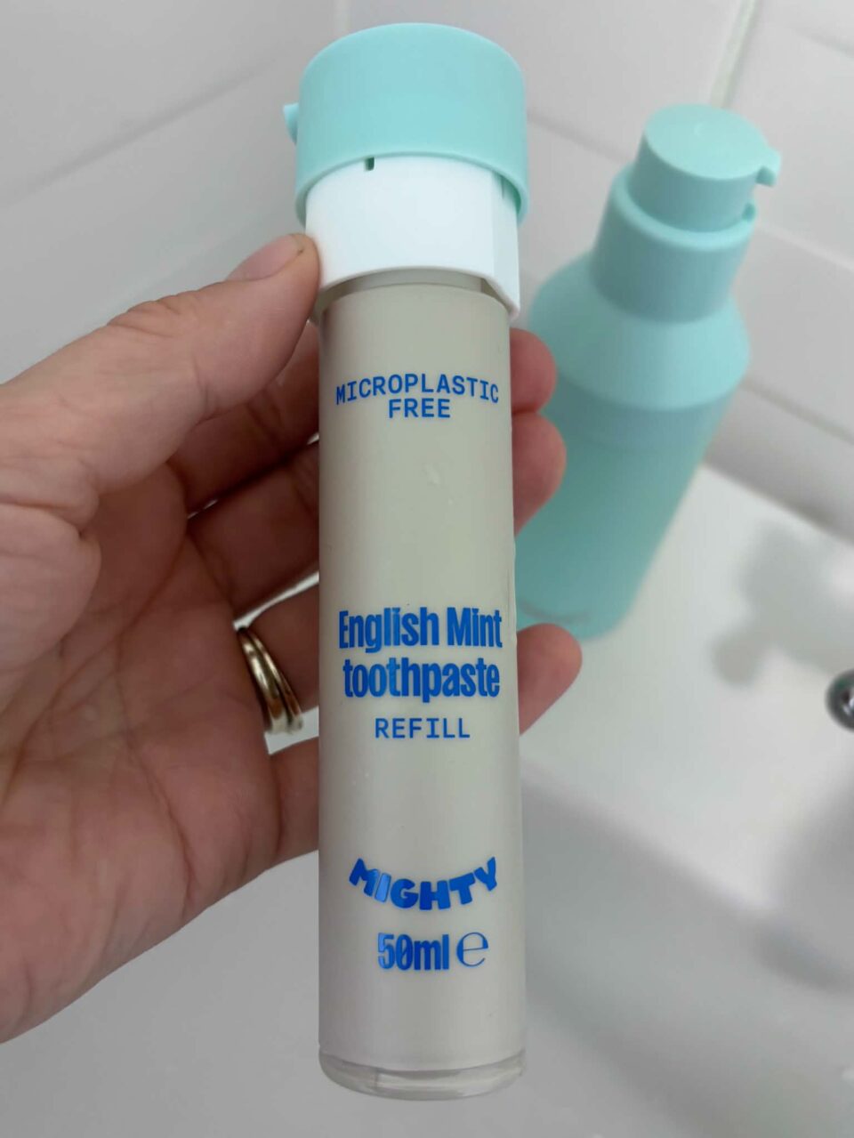 the old refill screwed into the lid