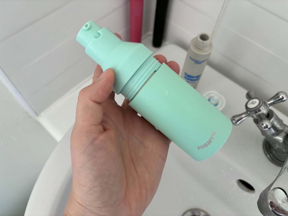 showing the lid going on the new V2 dispenser
