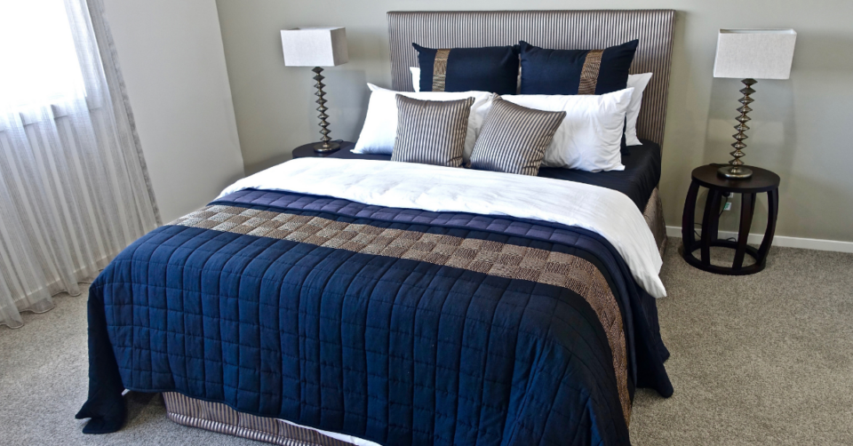 a bed with luxury bedding