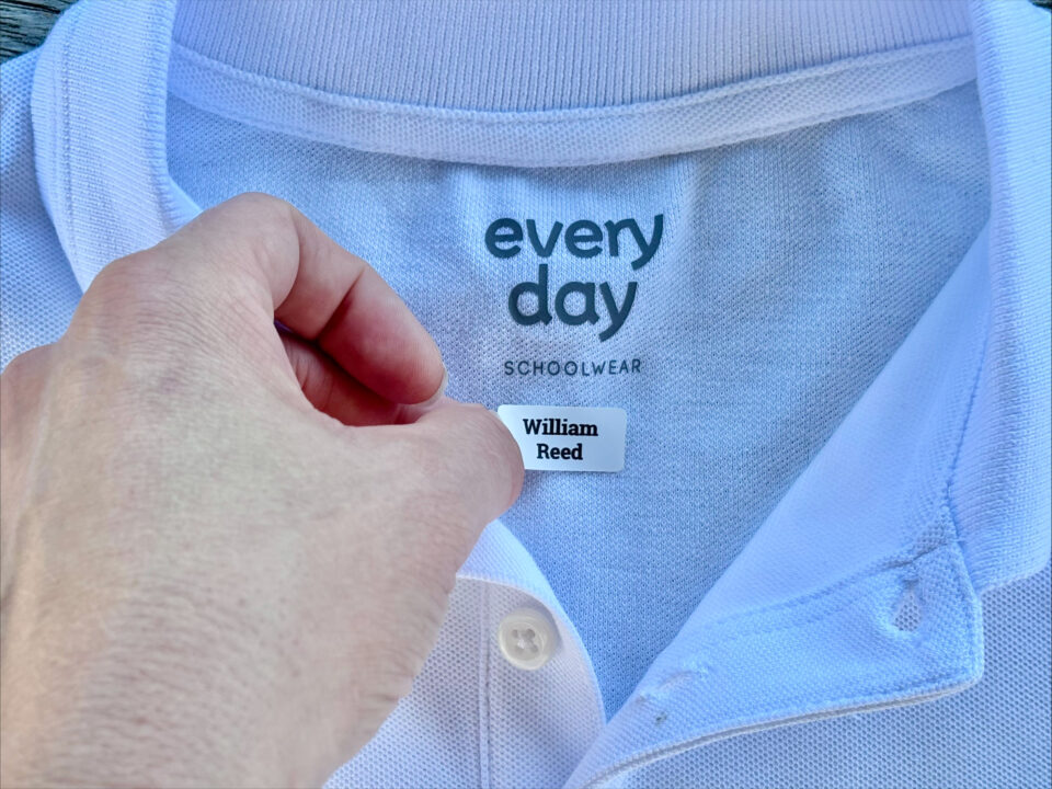 white polo shirt for school having a name label put on it