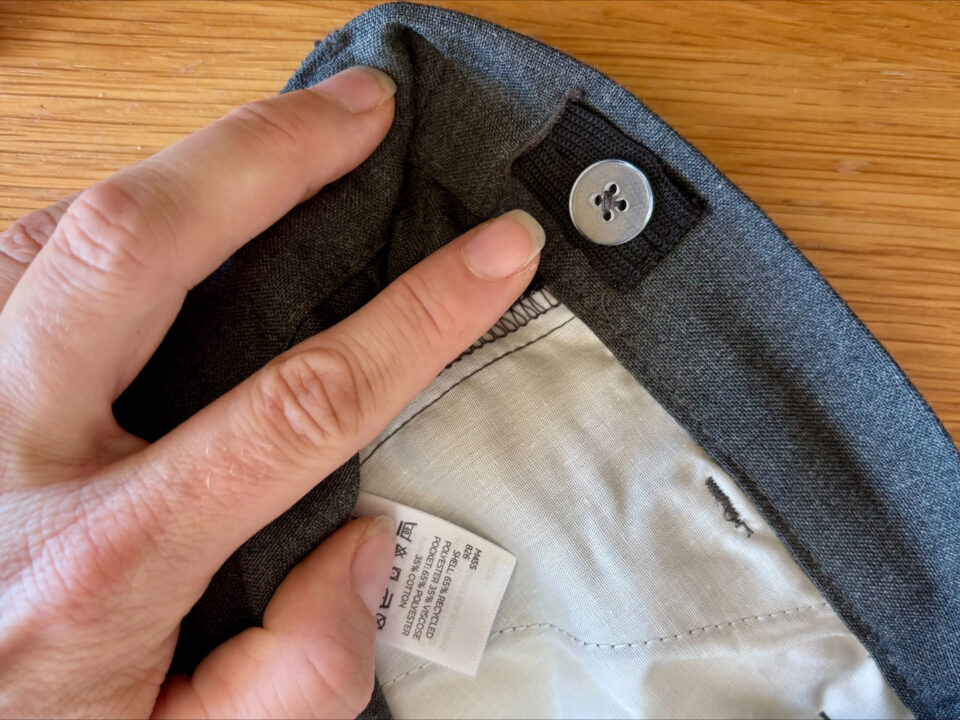 the adjustable waistband inside a pair of school trousers