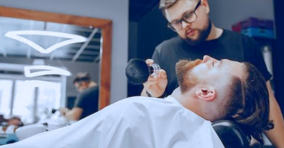 a man getting groomed at the barber