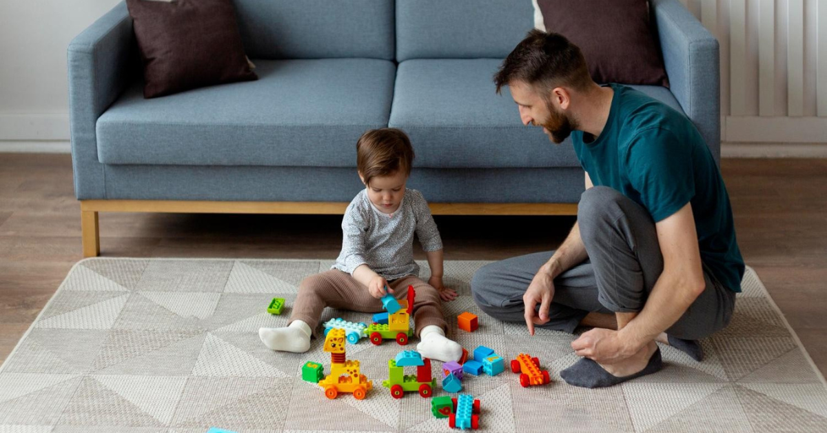 baby and dad on play mat