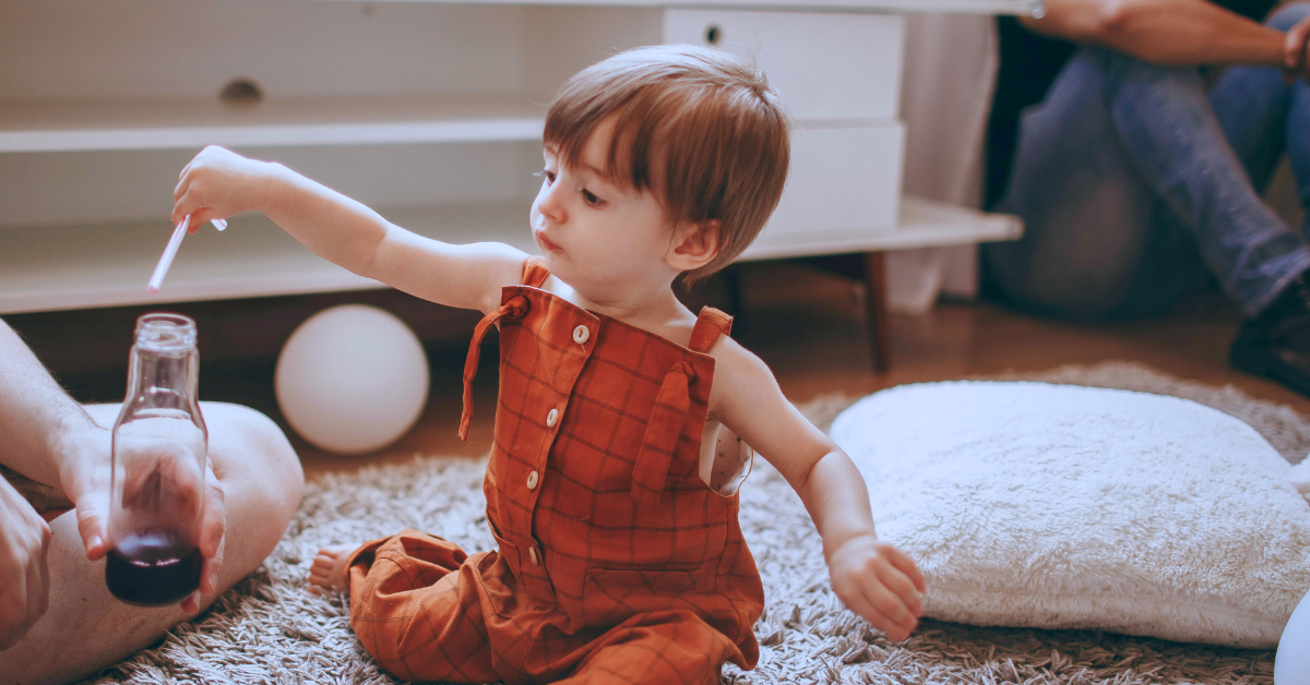 toddler with a drink