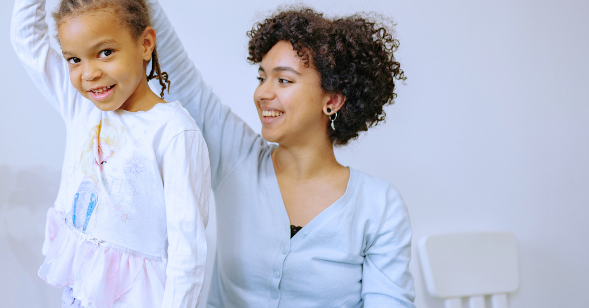 a woman twirling a small girl