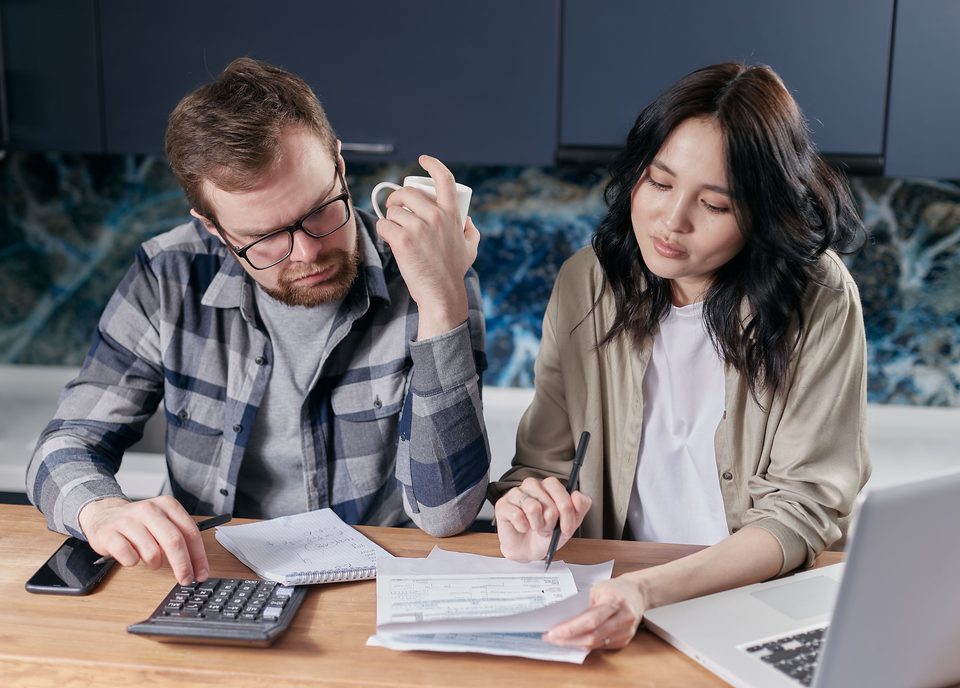 Parent helping daughter set budget for their car ownership